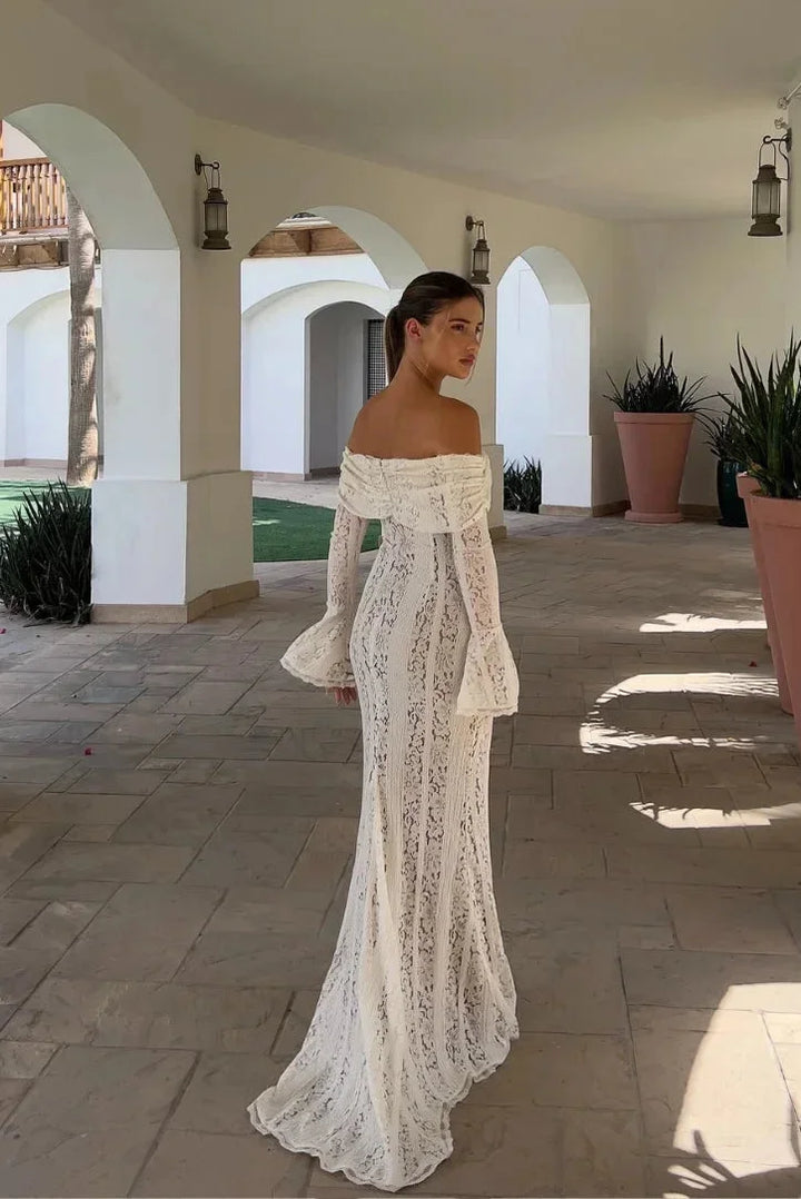 Off-shoulder ivory lace maxi dress with beautiful bell sleeves, perfect for a boho chic look.