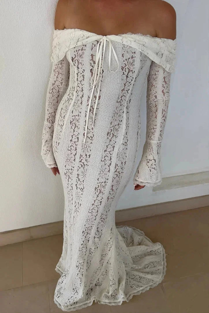 Off-shoulder ivory lace maxi dress with bell sleeves, delicate and elegant design perfect for special occasions.