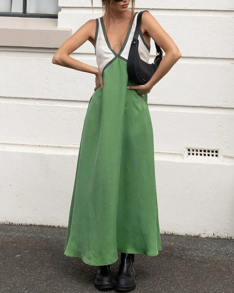 "Women’s maxi dress with v-neck and panel design, made of lightweight organic cotton blend. Perfect for casual chic…