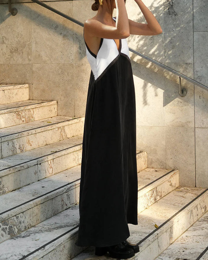 "Black v-neck maxi dress with panel design for women, made from sustainable fabric."