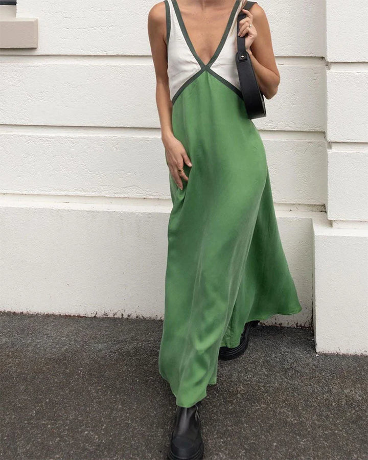 "Green v-neck maxi dress with panel design for women, made of soft flowing fabric, perfect for casual or special occasions."