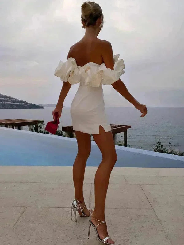 Off-shoulder fitted mini dress with ruffles, made of stretchy fabric, hugging curves elegantly. A charming and feminine…