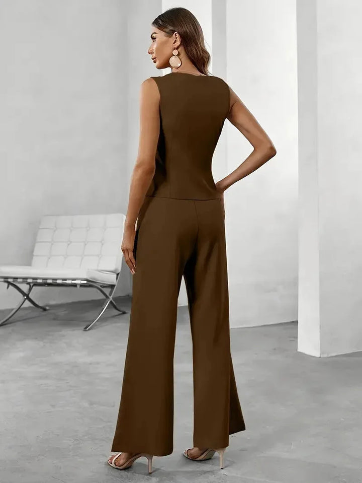 "Women's tailored vest set in navy blue with wide-leg pants, ideal for professional attire or formal occasions."