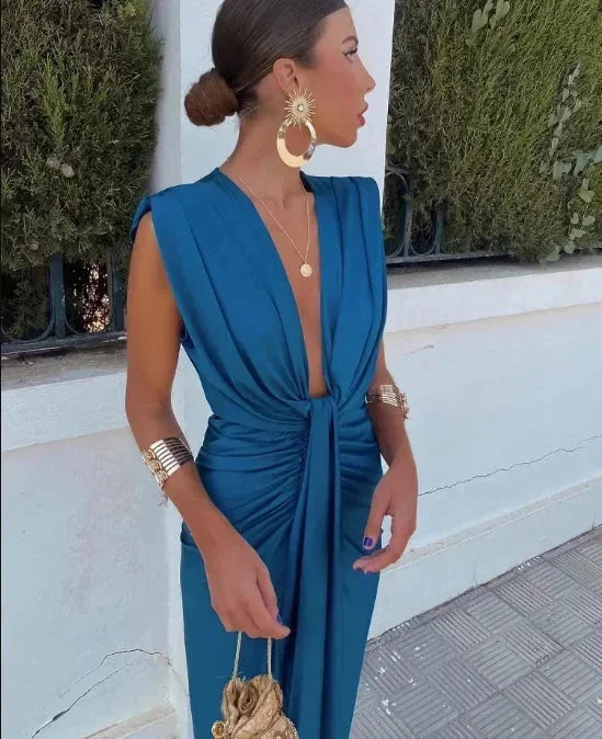 "Navy blue draped maxi dress with a modest design, perfect for evening occasions. Made of soft chiffon fabric."