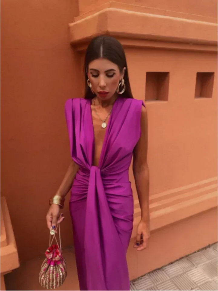 Pink draped maxi dress featuring a flowing silhouette perfect for evening occasions, made of soft, lightweight fabric with…