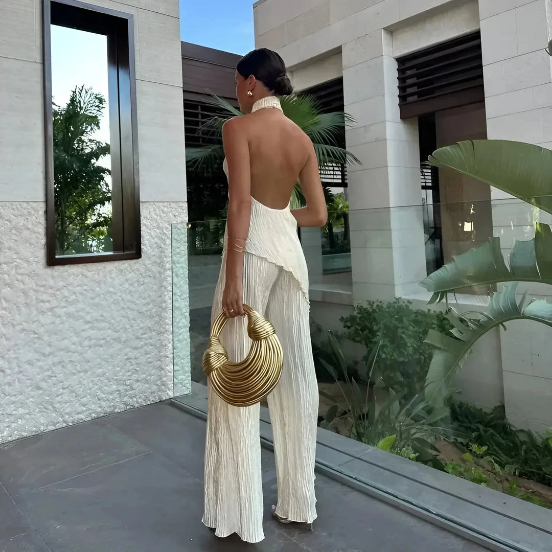 White textured halter jumpsuit for women, featuring a sleek design perfect for any occasion.