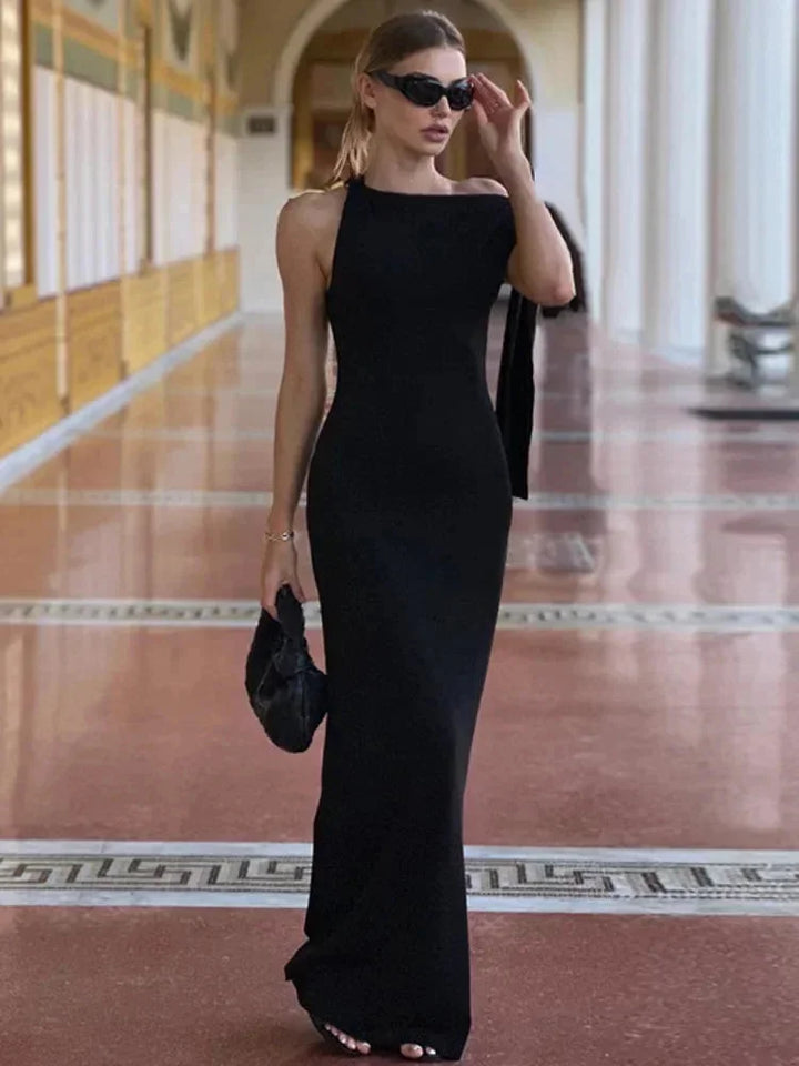 Black maxi dress with side bow detail for women. Features a streamlined design in a soft and comfortable fabric.
