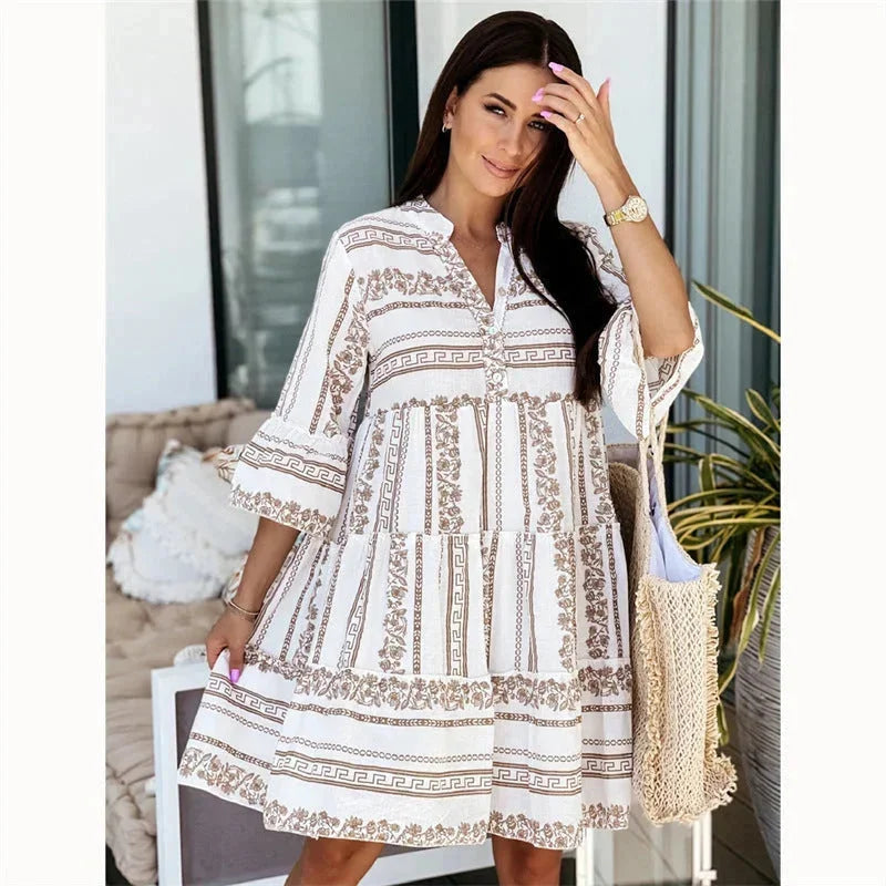 Brown airy v-neck mini dress with tiered skirt for women, perfect for a casual day out.
