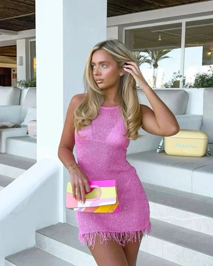 Red sleeveless mini dress with textured fringe detailing, perfect for a chic and trendy look.