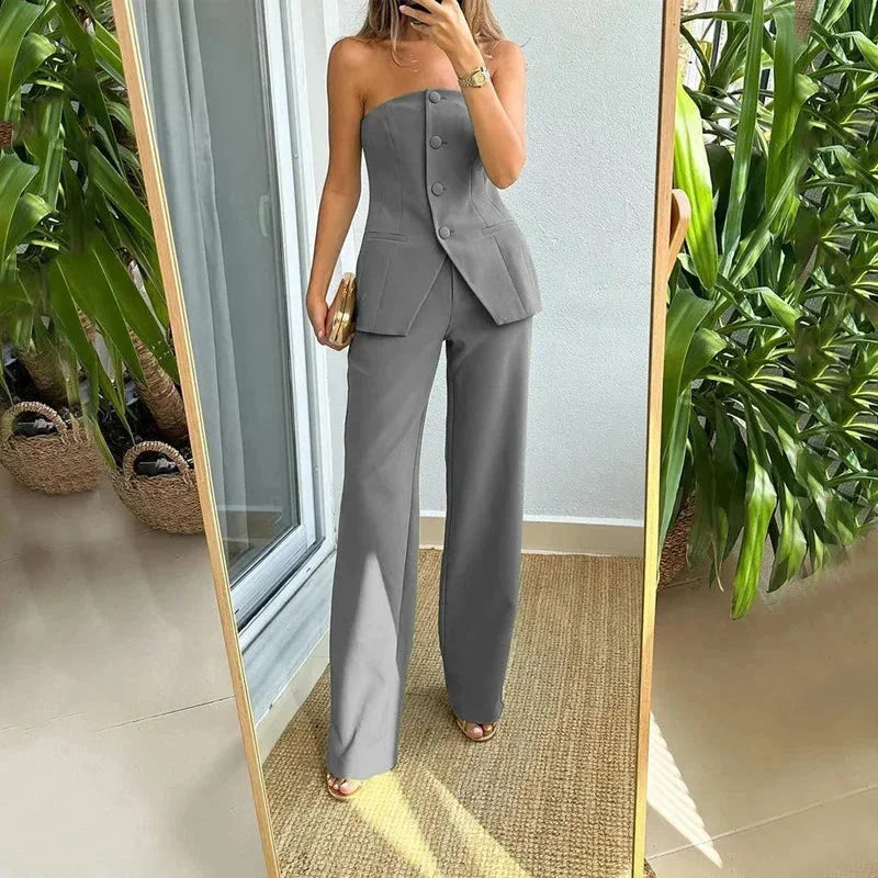 "Gray strapless top paired with stylish pants for women. Features a trendy design in a comfortable and versatile material."