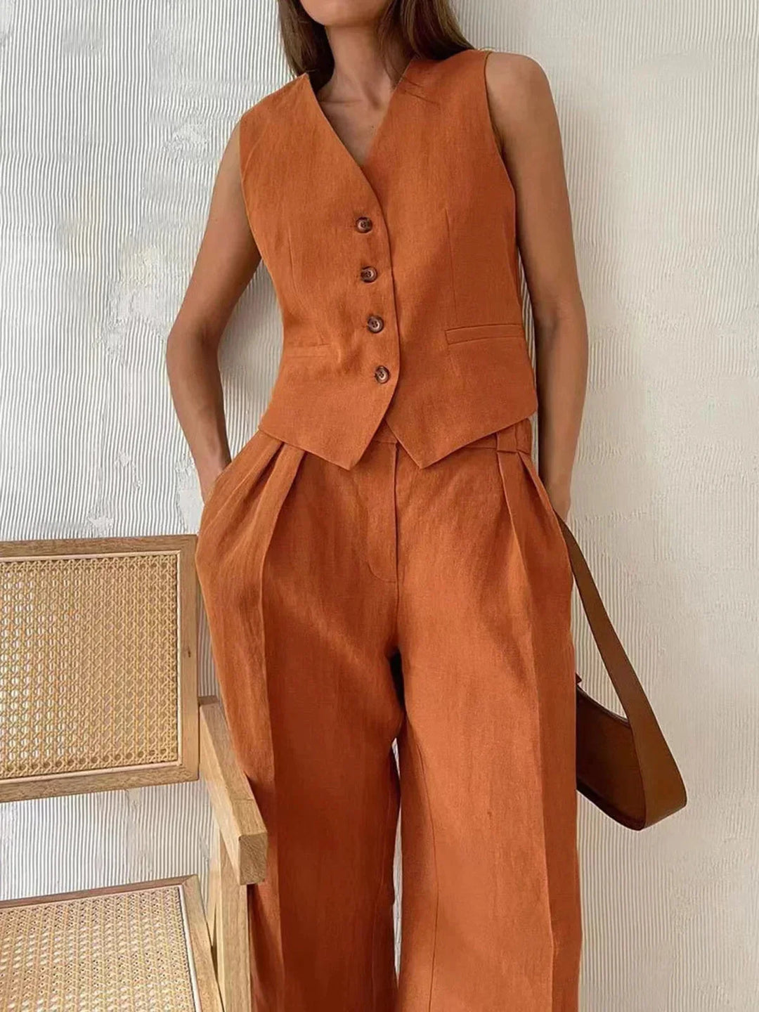 "Minnie women's ensemble featuring a chic black vest and matching pants with sleek design and comfortable fit."