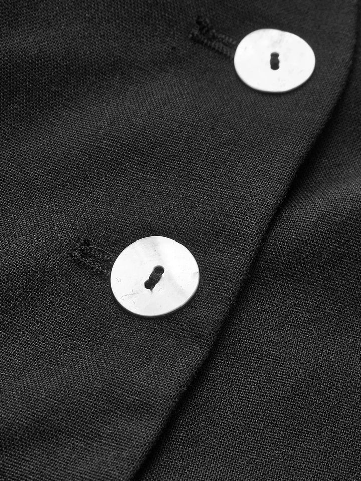 "Women's black vest and matching pants set with pinstripe design, made from high-quality wool blend fabric."