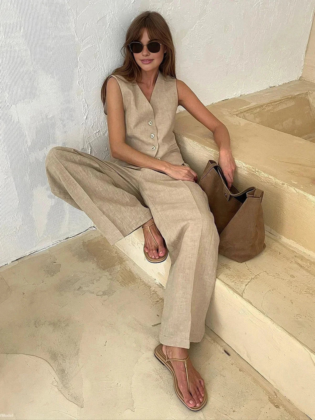 Women's two-piece vest and pants set in gray featuring a tailored fit and trendy ribbed design.