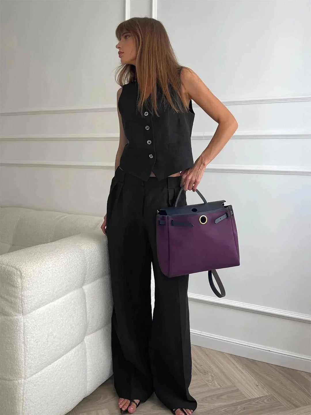 "Black women's vest and pants set with stylish tailored design and premium fabric material."