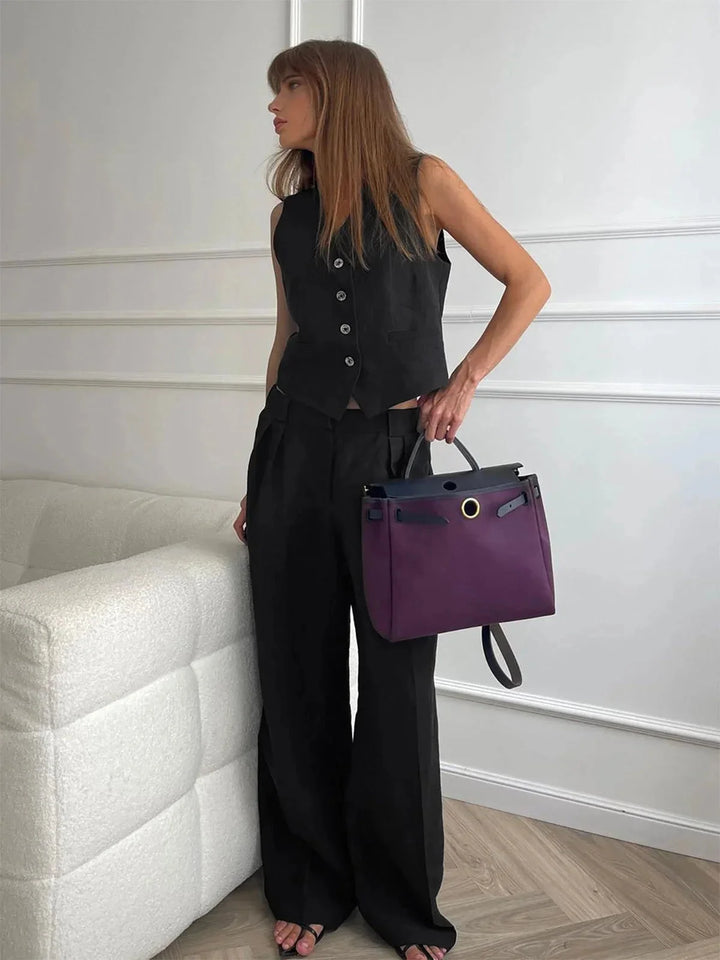 "Black women's vest and pants set with stylish tailored design and premium fabric material."