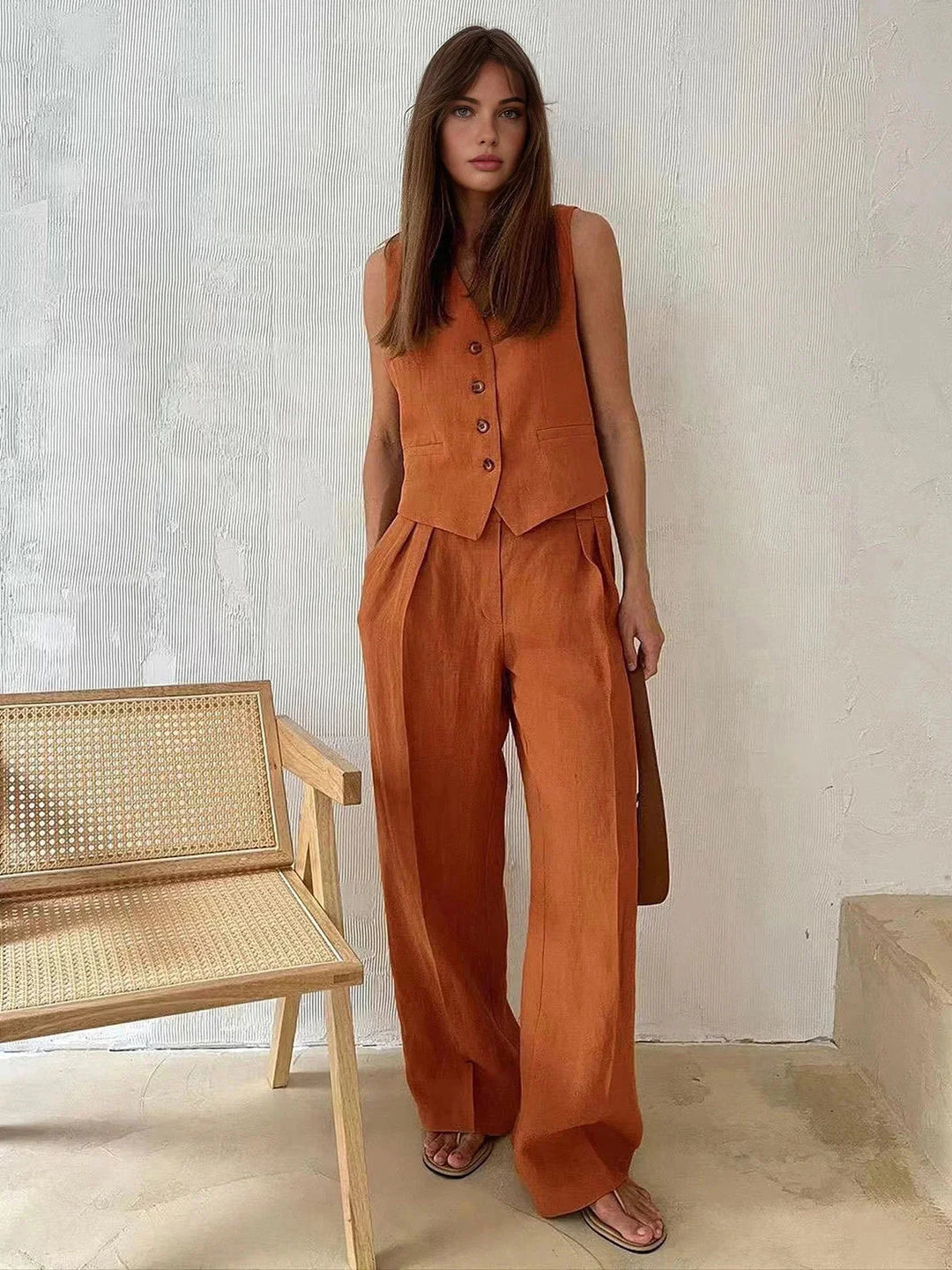 Orange vest and pants set for women named Minnie. Sleeveless vest with matching straight-leg pants in a comfortable and chic…