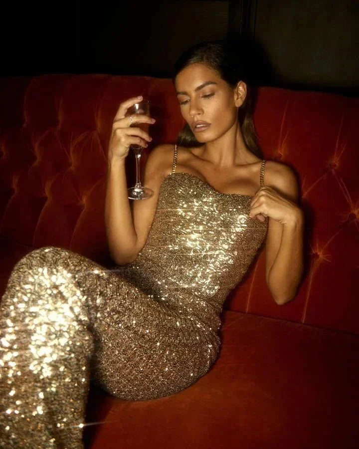 Strapless jumpsuit in sparkling fabric, features a slimming belt for a stylish look.
