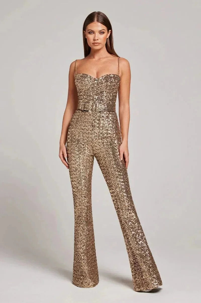 Black jumpsuit with shimmering sequins and slimming belt. Strapless design adds elegance and sophistication to any occasion.