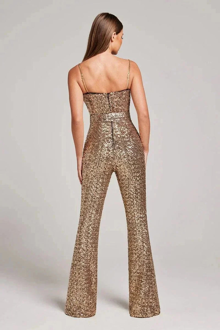 Strapless sparkling jumpsuit in black with slimming belt, perfect for a chic evening look.