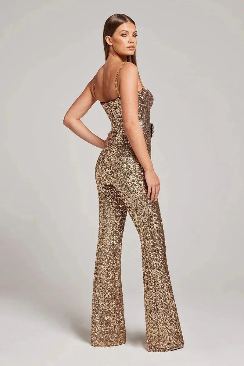 Strapless jumpsuit in sparkling fabric with a slimming belt, chic and glamorous design for special occasions.
