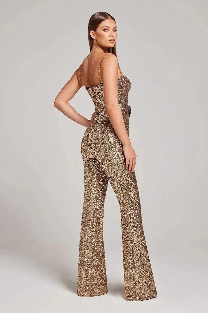 Strapless jumpsuit in sparkling fabric with a slimming belt, chic and glamorous design for special occasions.
