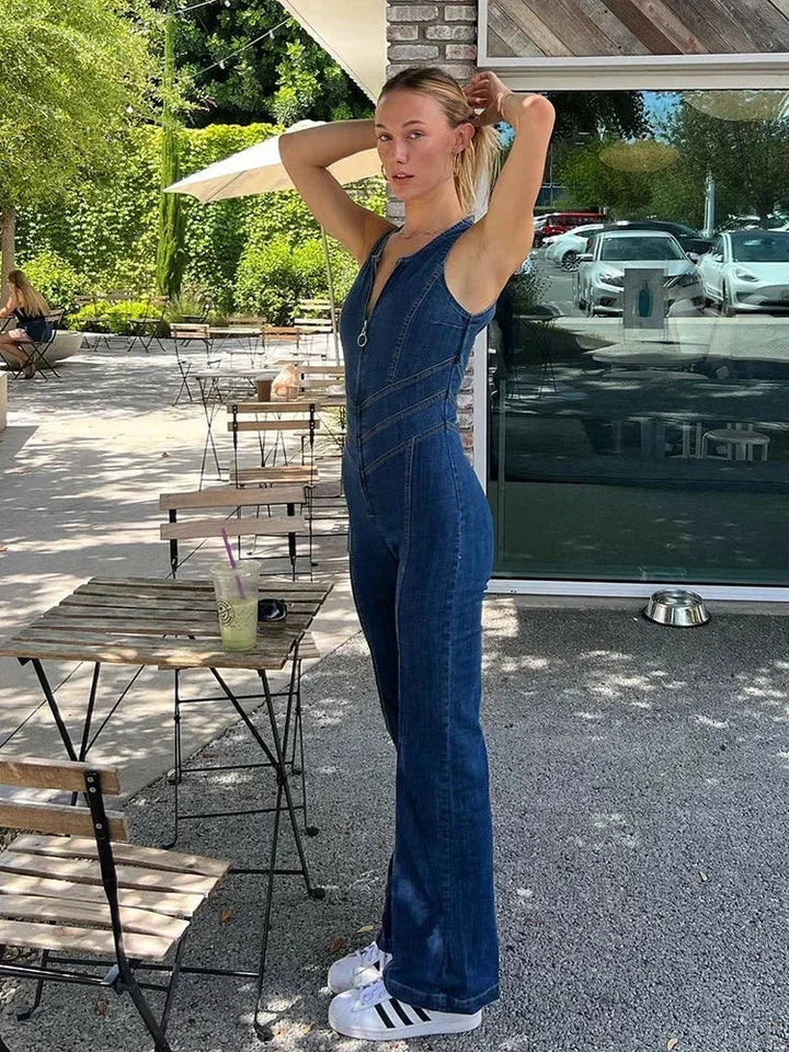 Blue sleeveless jumpsuit with fitted bodice and flared legs, made of soft and breathable fabric. Perfect for a stylish and…