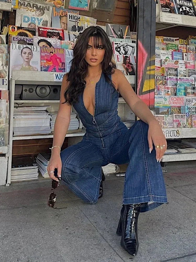 "Sleeveless blue jumpsuit with fitted bodice and flared legs, perfect for summer. Made from lightweight and breathable…
