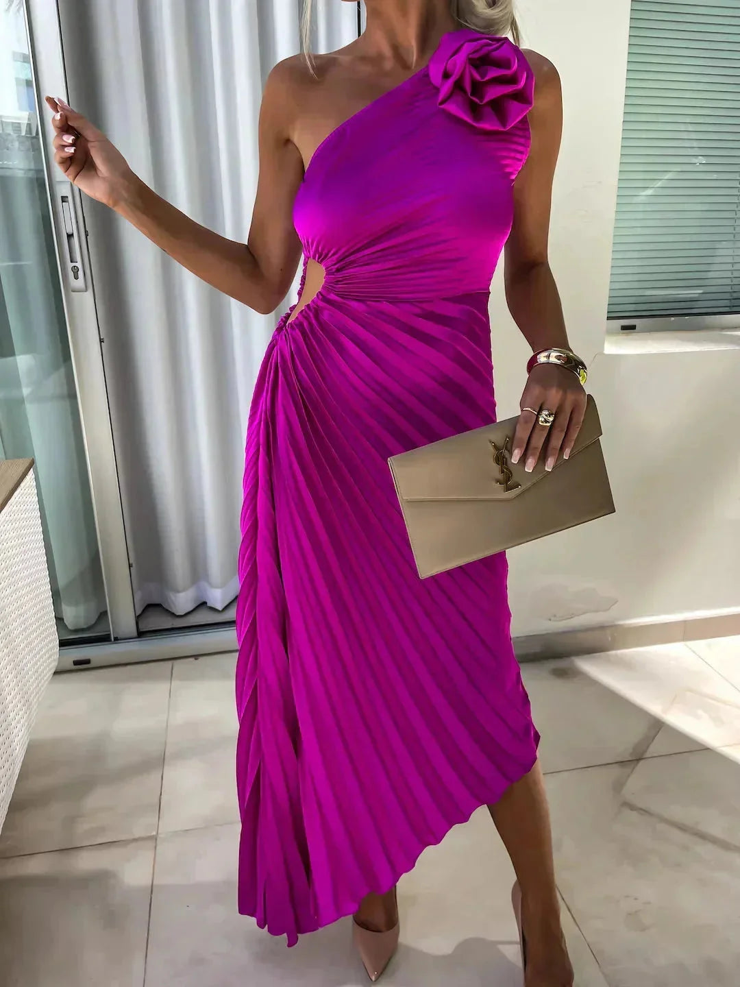 Black pleated one-shoulder women's dress with a flowy silhouette and asymmetrical neckline.