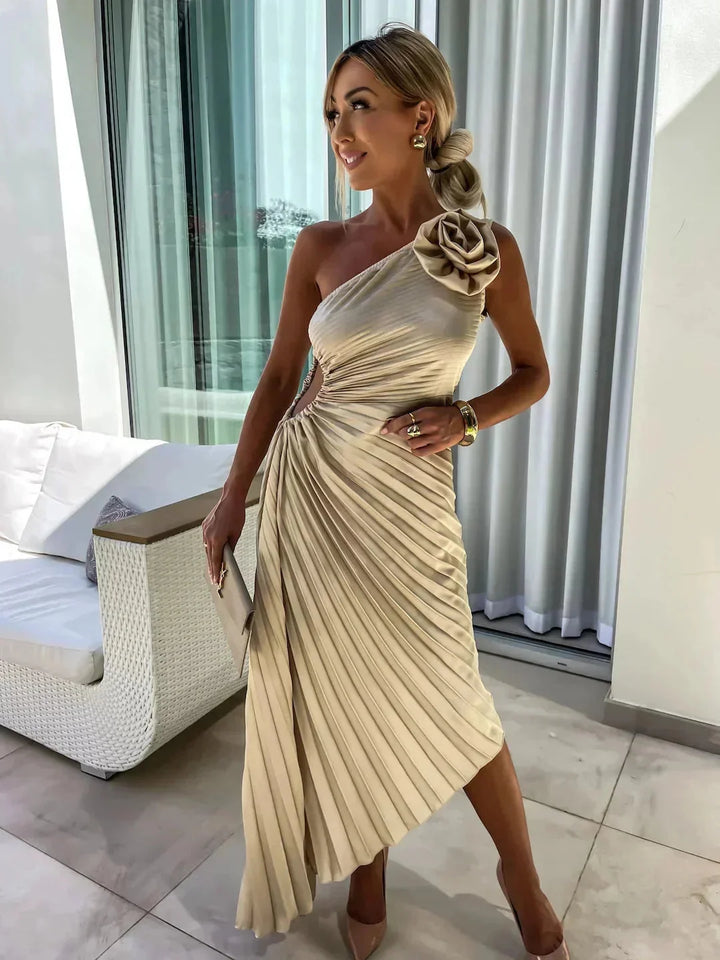 Beige pleated one-shoulder dress for women by Stormii. Features a stylish and elegant design suitable for various occasions.