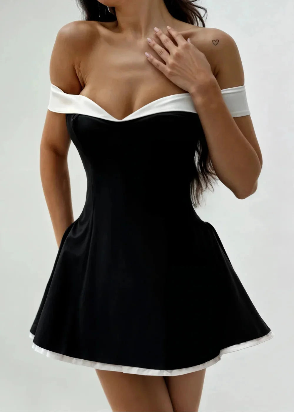 Off-shoulder black dress with white trim for women, showcasing a stylish and elegant design perfect for any occasion.