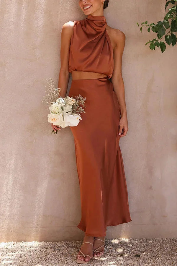 Brown satin halter top and skirt set designed for women by Zoha. A stylish duo featuring a sleek design with a lustrous…