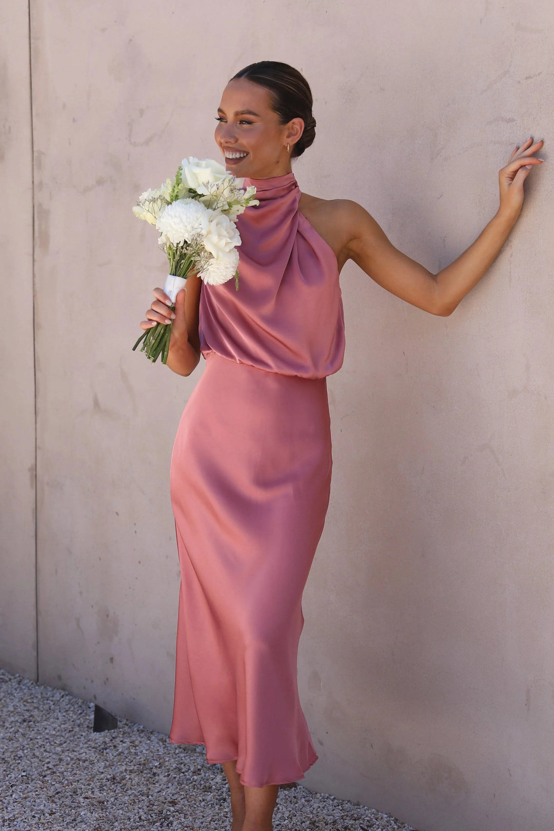 Pink satin halter top and skirt set for women by Zoha. Elegant halter design with a smooth satin finish, perfect for special…
